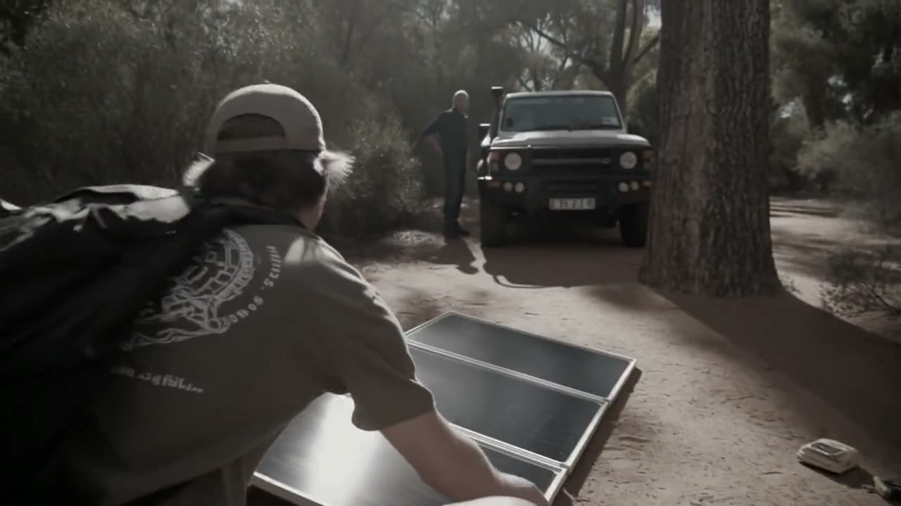 Folding solar panel set up at a campsite